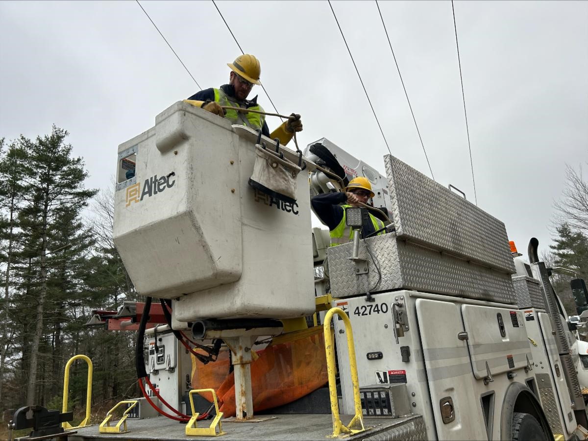 workers in a power truck