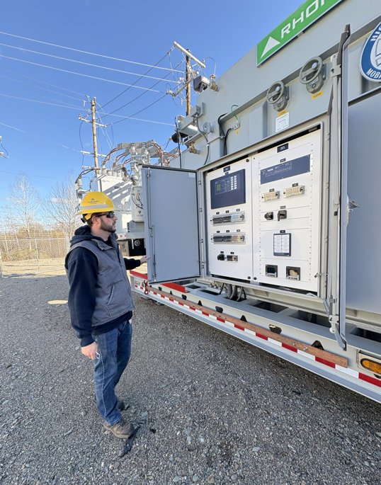 Versant Power employee touring the new substation