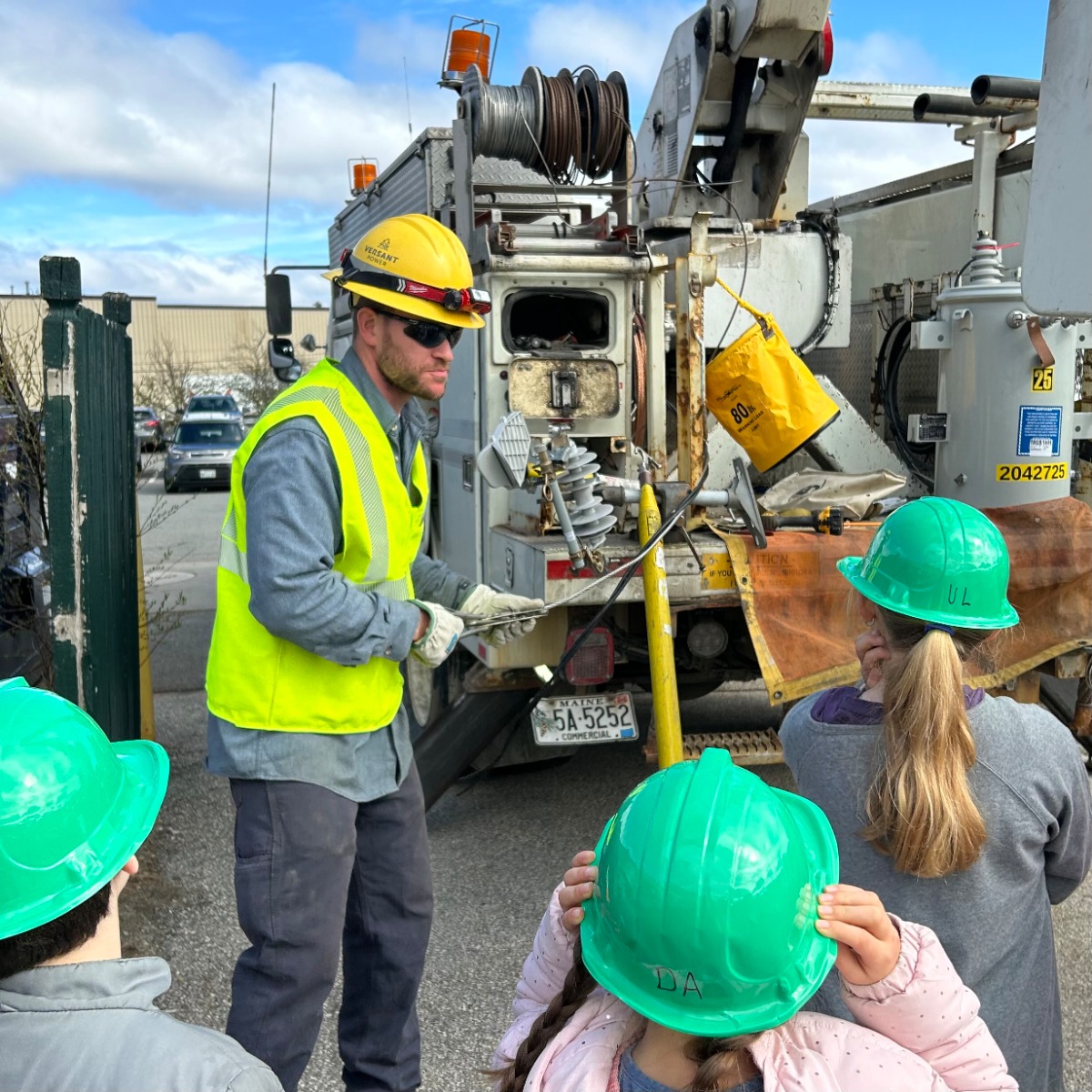 Versant employee teaching kids